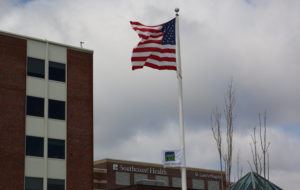 New Enlgand Donor Services Flag flying in front of St. Luke's Hospital