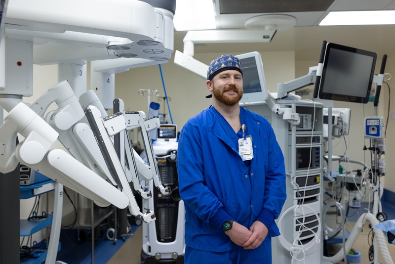 man in scrubs standing in an operating room